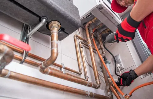 NATE-certified HVAC technician performing professional repair in a Belton, TX home